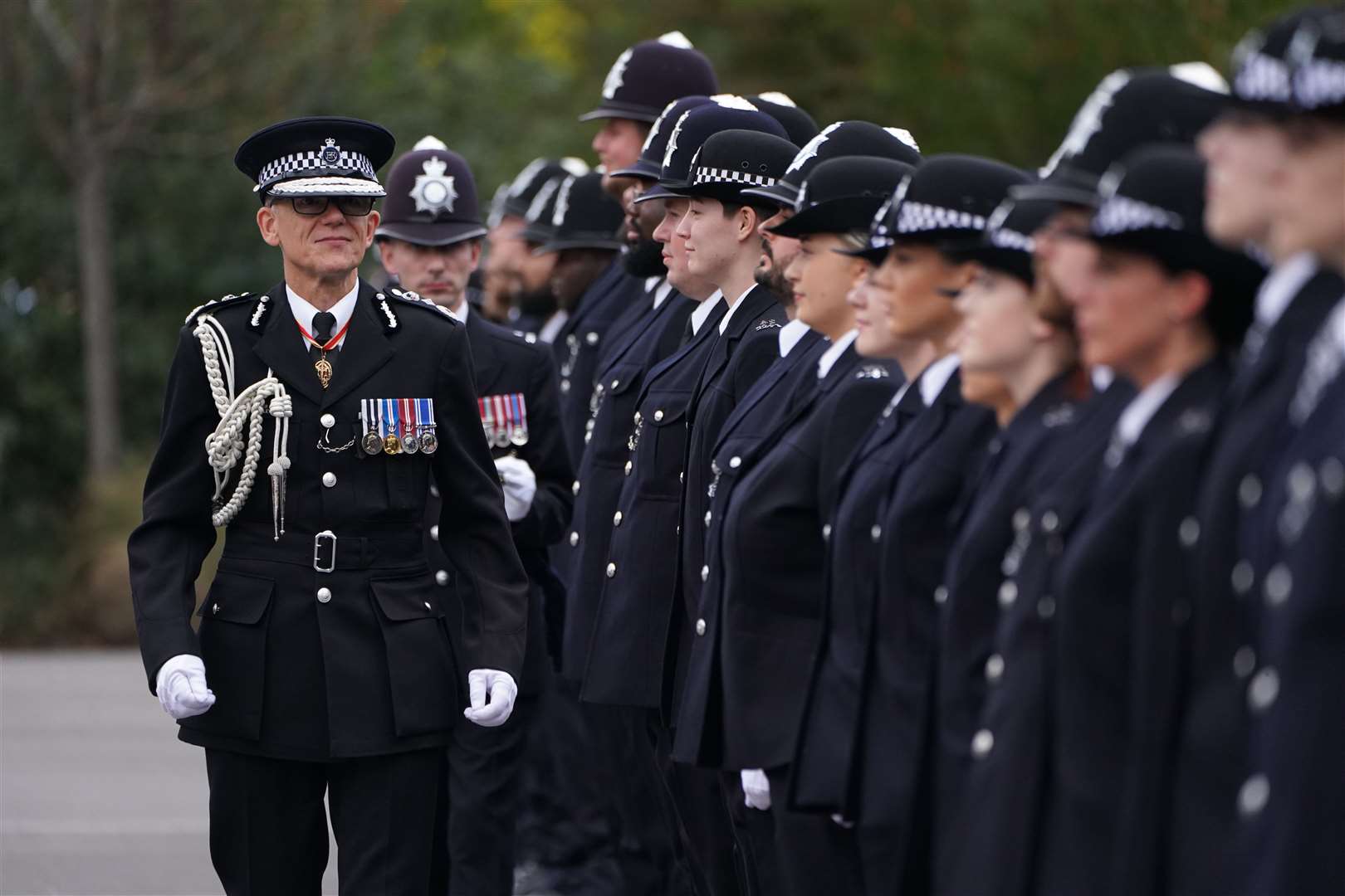 Metropolitan Police Commissioner Mark Rowley inspects new police recruits during his first passing-out parade since taking charge of the force, at Hendon Police College (Kirsty O’Connor/PA).