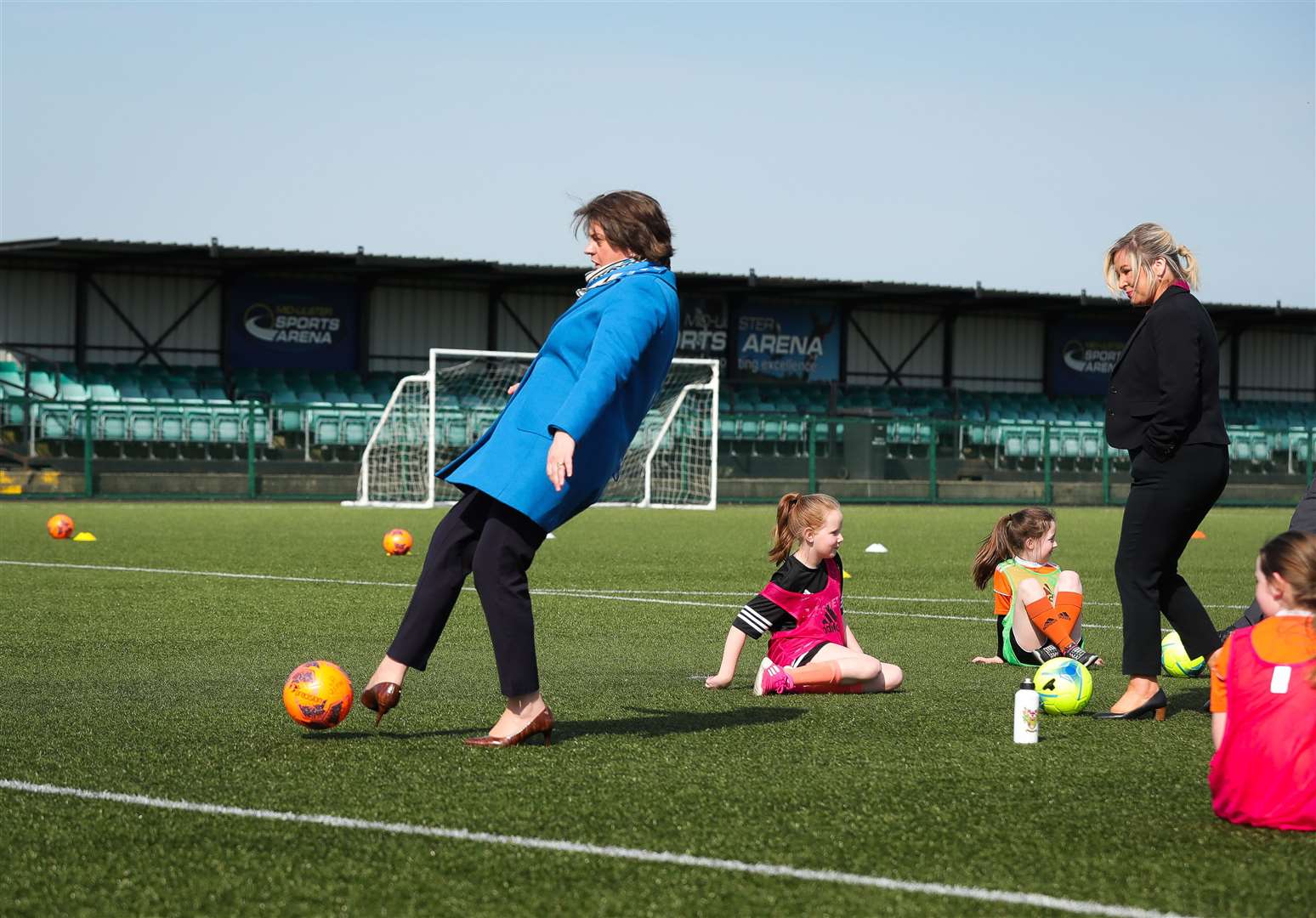 Arlene Foster and Michelle O’Neill taking part in a football training session in April (Kelvin Boyes/Press Eye/PA)