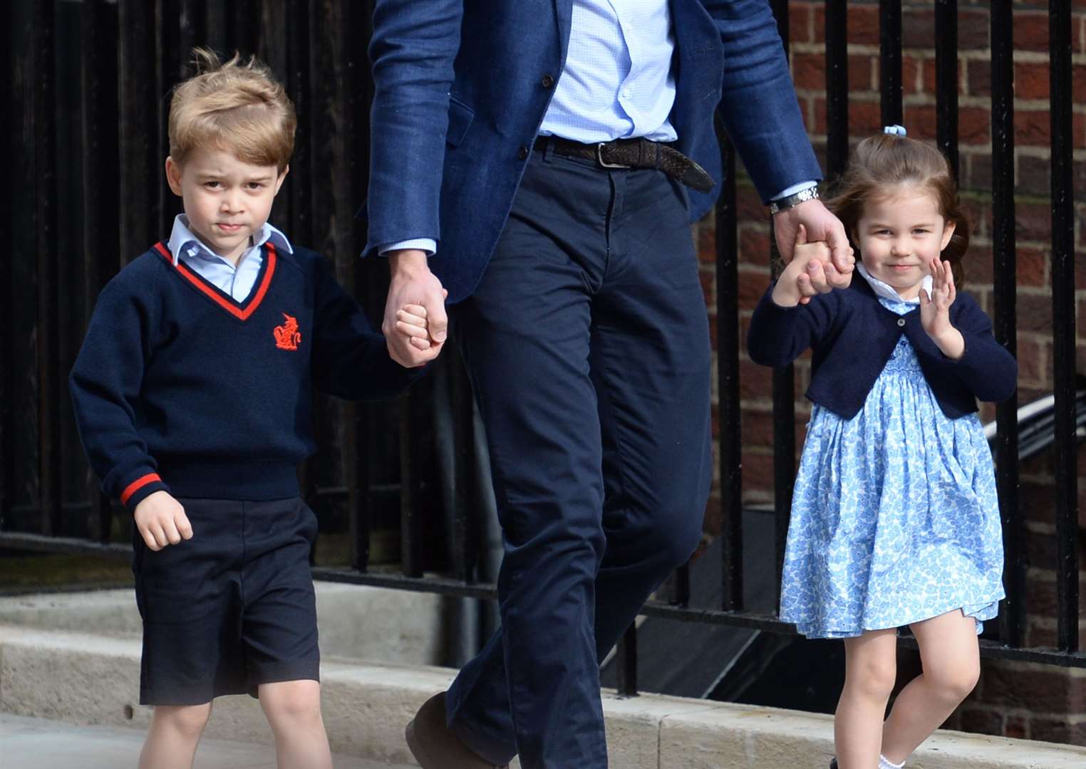 Prince George and Princess Charlotte with their father as they visited their mother and newborn brother Prince Louis at the Lindo Wing at St Mary’s Hospital in London in 2018 (PA)