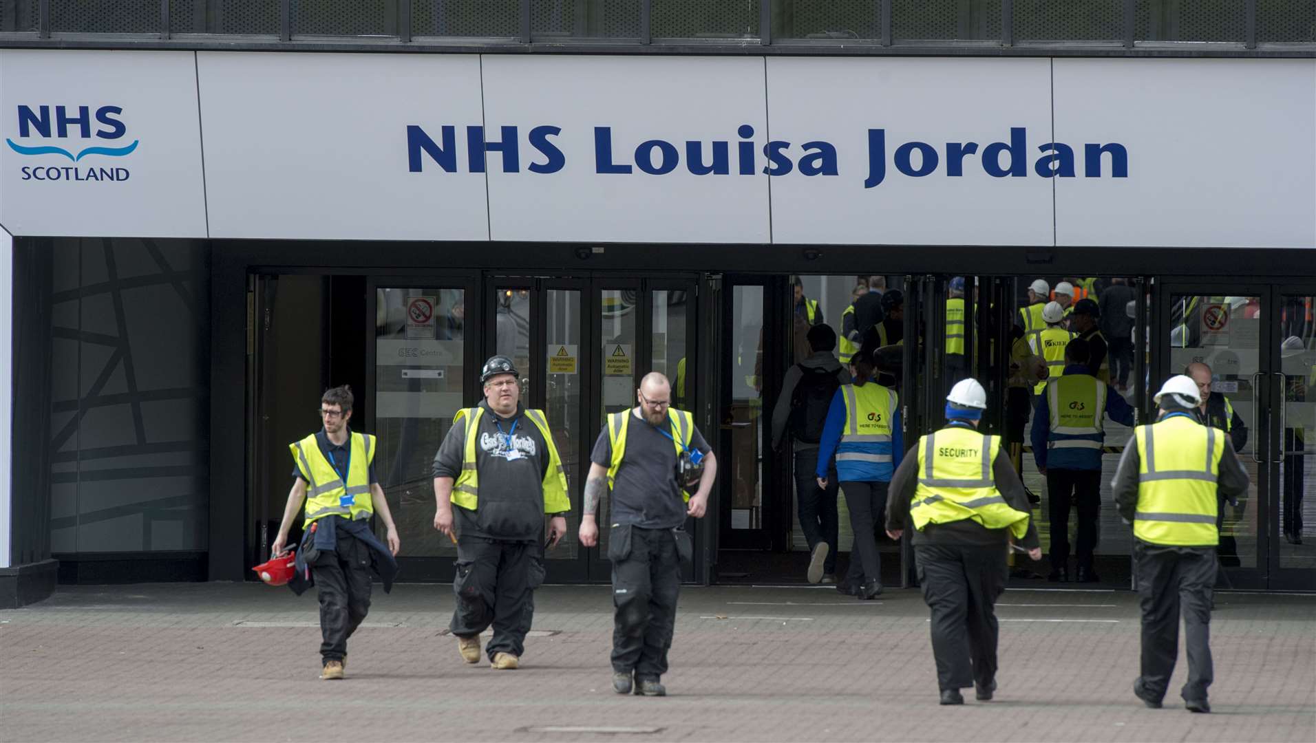 Workers outside the temporary NHS Louisa Jordan Hospital in Glasgow (Ian Rutherford/PA)