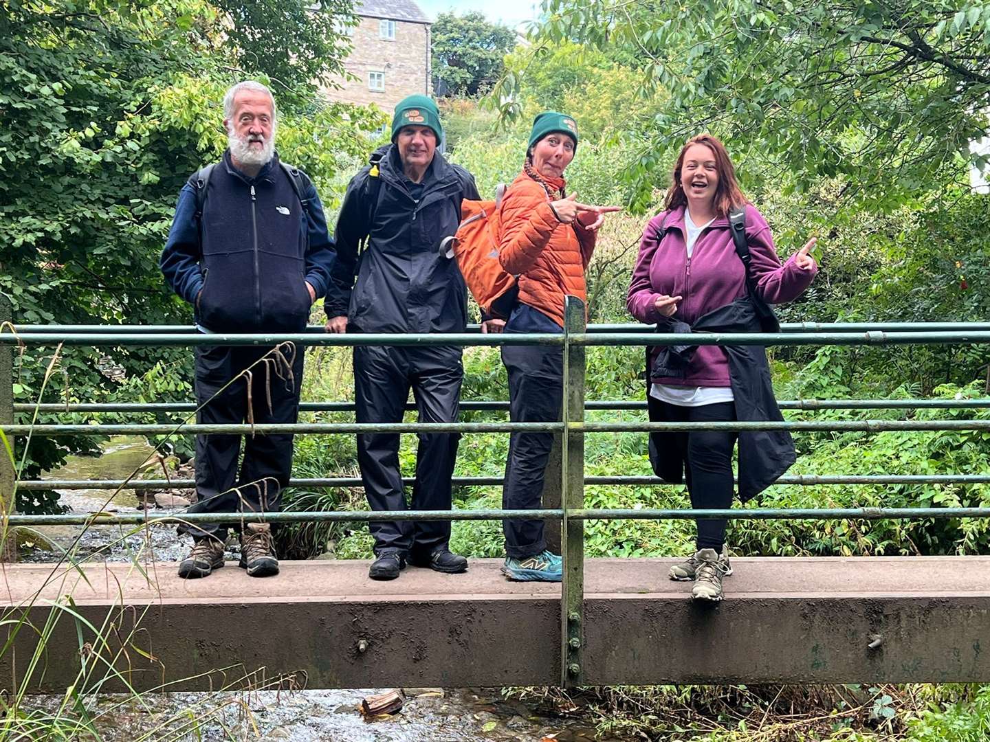 The group, pictured crossing the border into England, are more than halfway into their epic fundraising walk (Mike Liggins/PA)