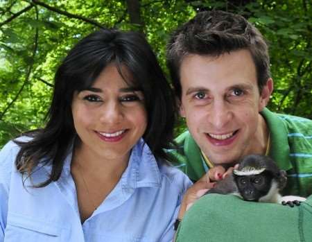 Presenters of BBC childrens' TV series ROAR, Rani Price and Matthew Skilton, with a diana monkey