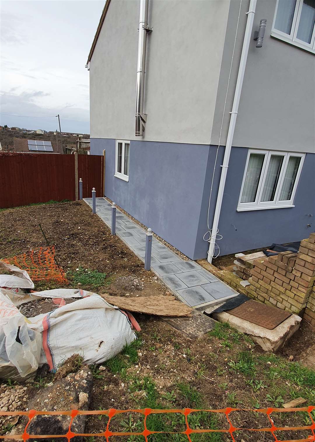 Paved pathway alongside house