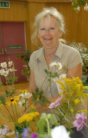 Jessica Ashdown with her vase of six perennial flowers.