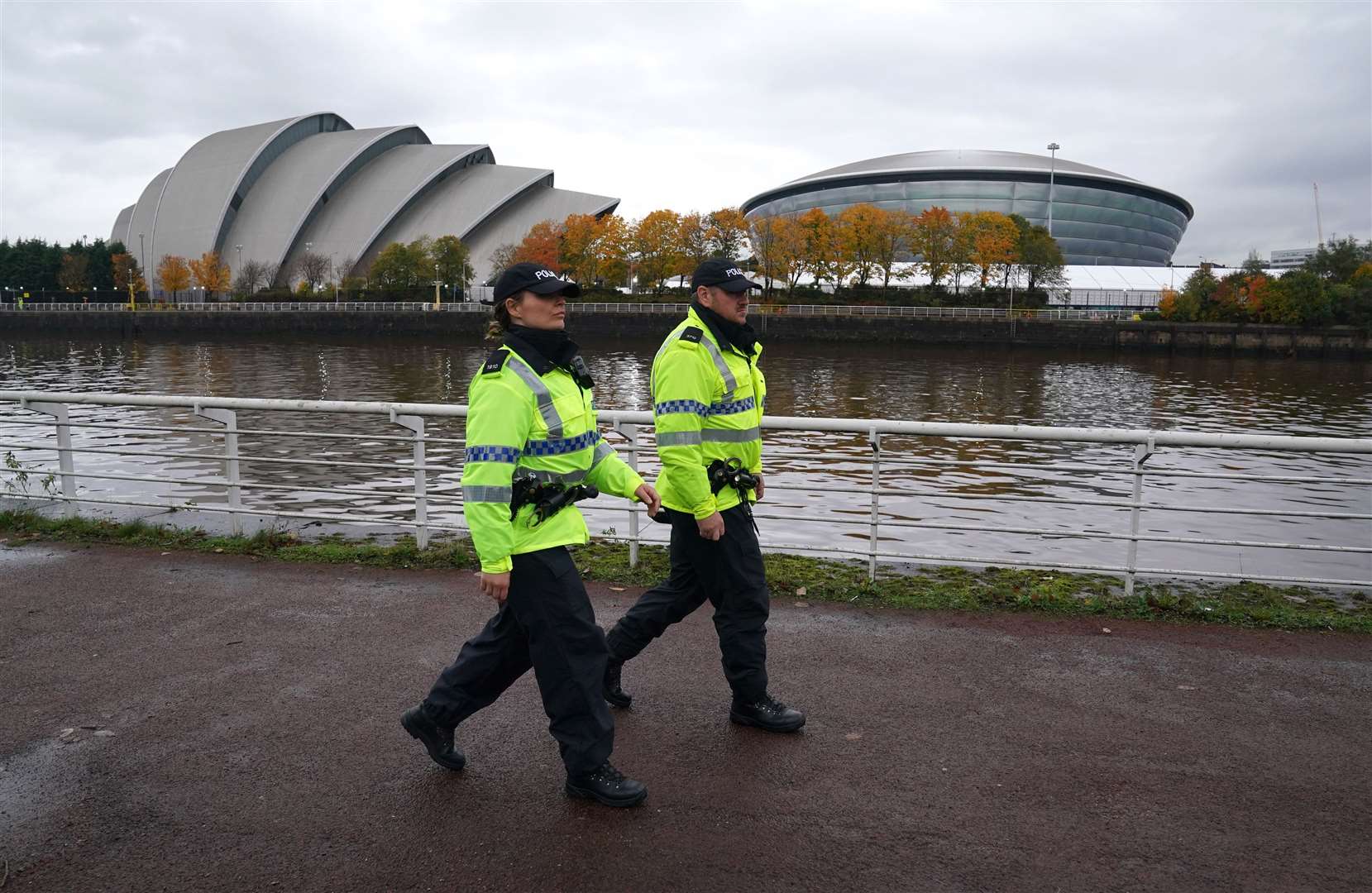 Police officers walk along the banks of the River Clyde (Andrew Milligan/PA)