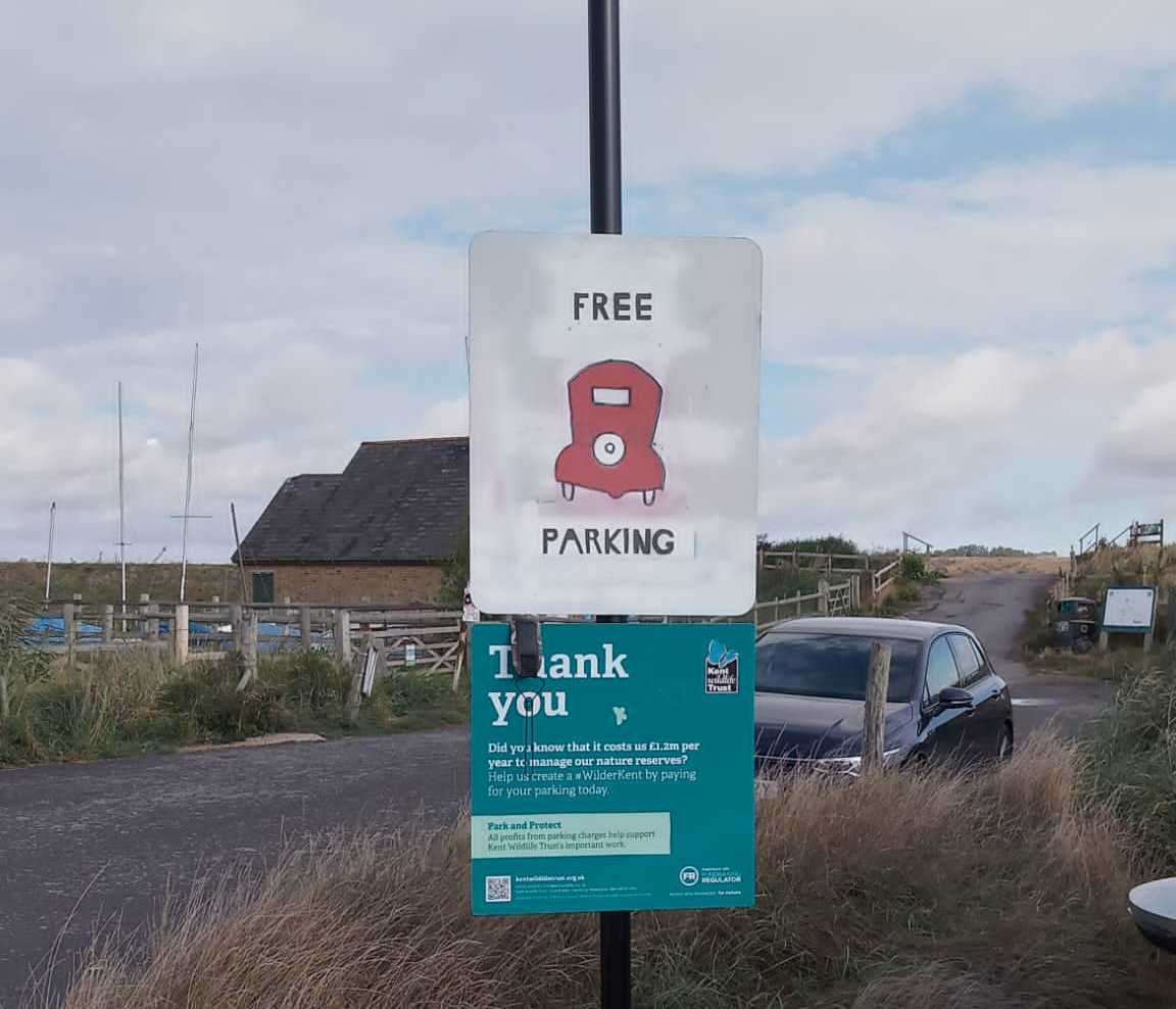 A parking charges sign has been vandalised at Kent Wildlife Trust site Oare Marshes. Picture: Kent Wildlife Trust