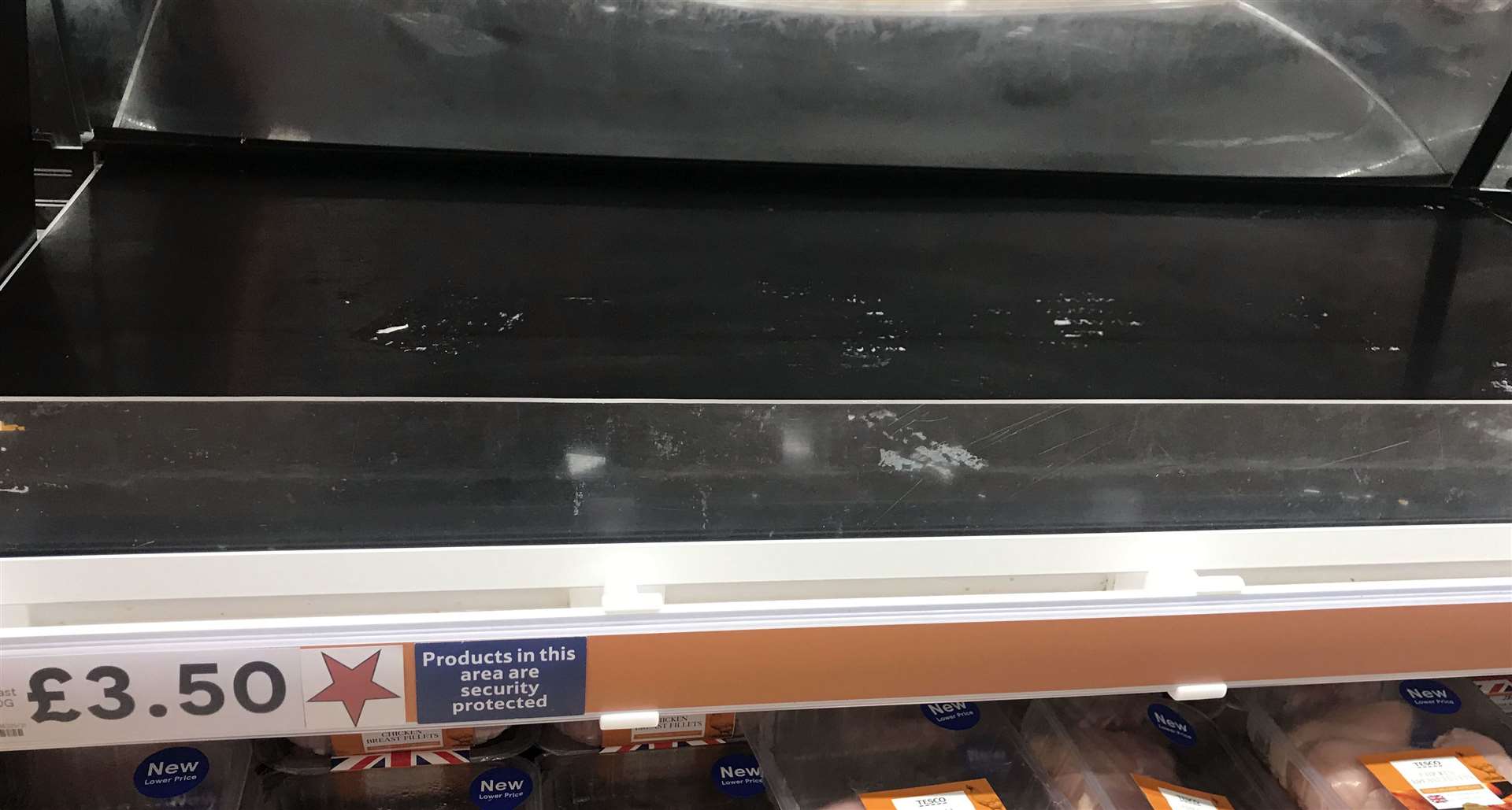 An empty shelf in the fresh chicken aisle at the Portsmouth North Harbour Tesco (Steve Parsons/PA)