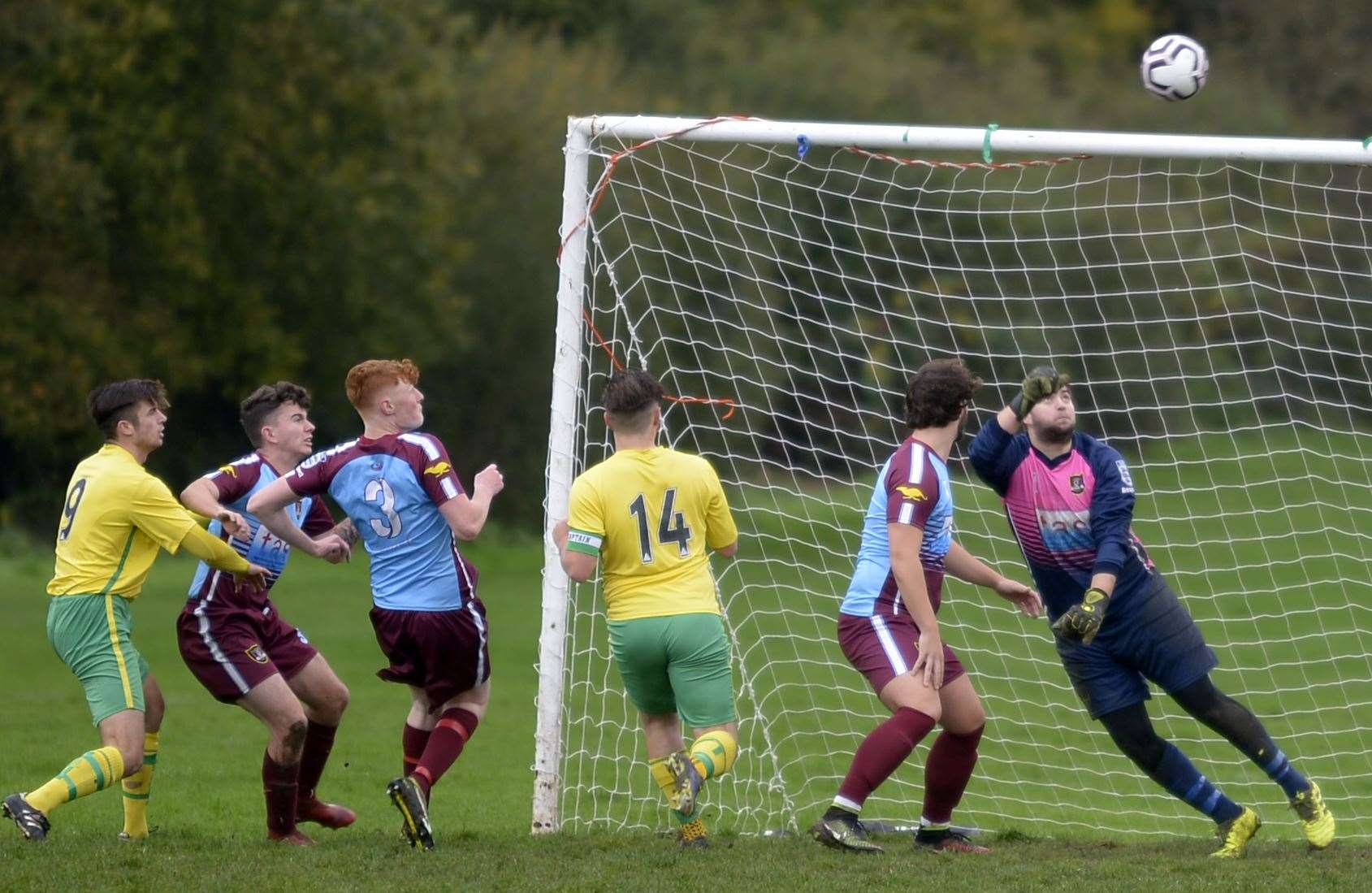 Goalmouth action between Medway Rovers 17 (green/yellow) and Wigmore. Picture: Barry Goodwin (42936786)