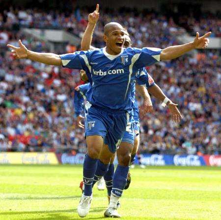 Simeon Jackson celebrates the goal that sent Gillingham back into League 1