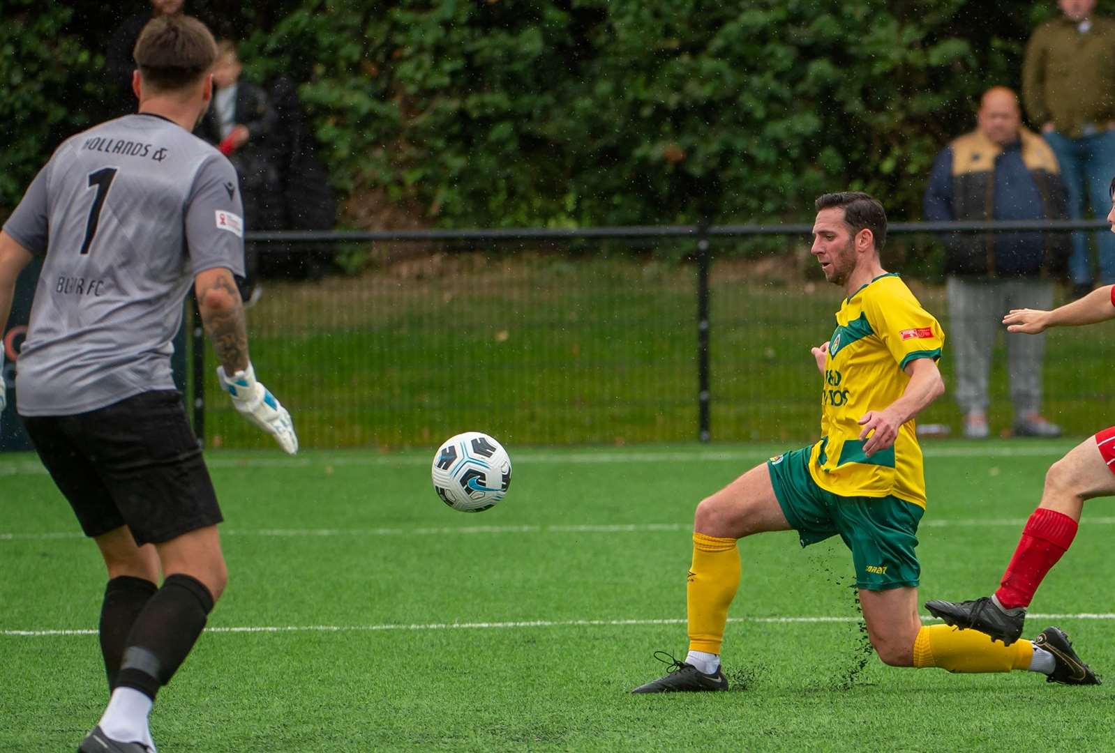 Experienced campaigner Ian Draycott scores one of his two goals in Saturday’s FA Cup win over Hollands & Blair. Picture: Ian Scammell