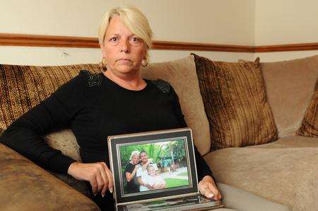 Heather Smith at home in Gravesend with a photo of sons Charlie and Kane
