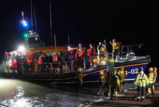 A group of people being rescued by an RNLI lifeboat at Dungeness after trying to cross the Channel in a small boat. Stock picture: Gareth Fuller/PA