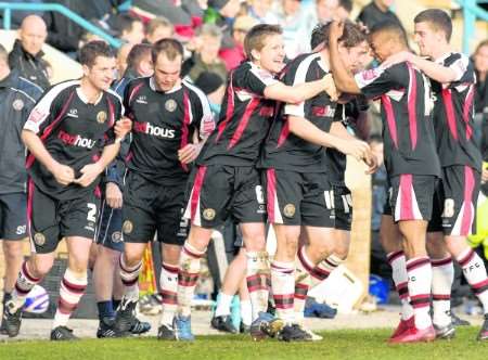 Mark Stimson (top left) looks deflated as Shrewsbury celebrate their last gasp leveller. Picture: Grant Falvey.