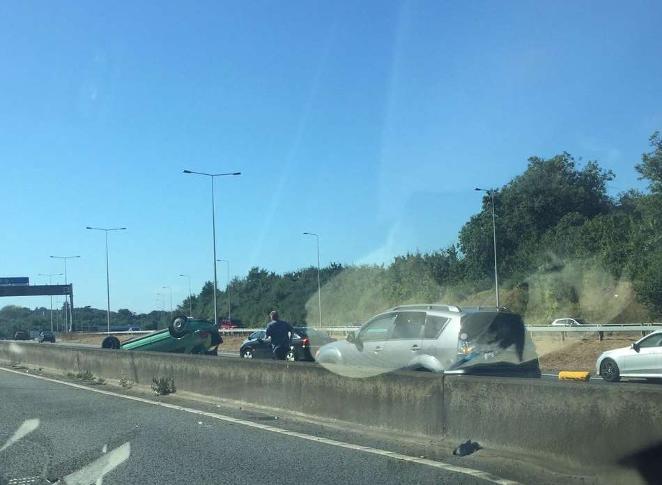 A car is on its roof after an accident on the M20. Picture: Harry Bristow