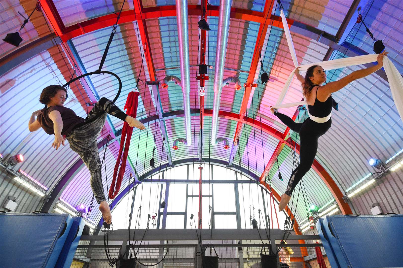 Aerialists Ruby Wain (right) and Catherine Ryan practice their skills on ribbons and hoops at Flying Fantastic in Southwark, London (Kirsty O’Connor/PA)