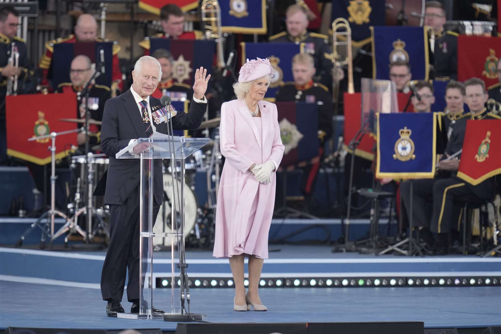 King Charles III and Queen Camilla on stage at the commemorative event for the 80th anniversary of D-Day in Portsmouth