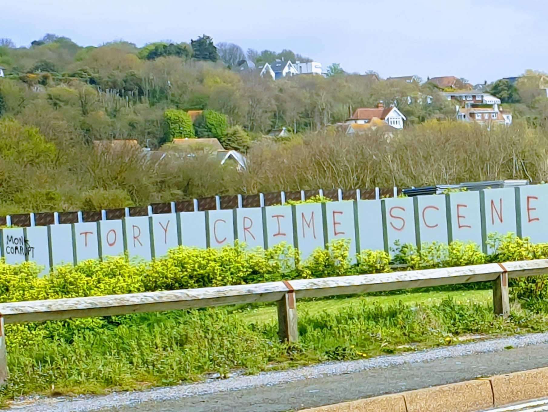 A slogan opposing the Princes' Parade scheme has been sprayed on hoardings around the seaside development in Hythe. Picture: Chris Lucas