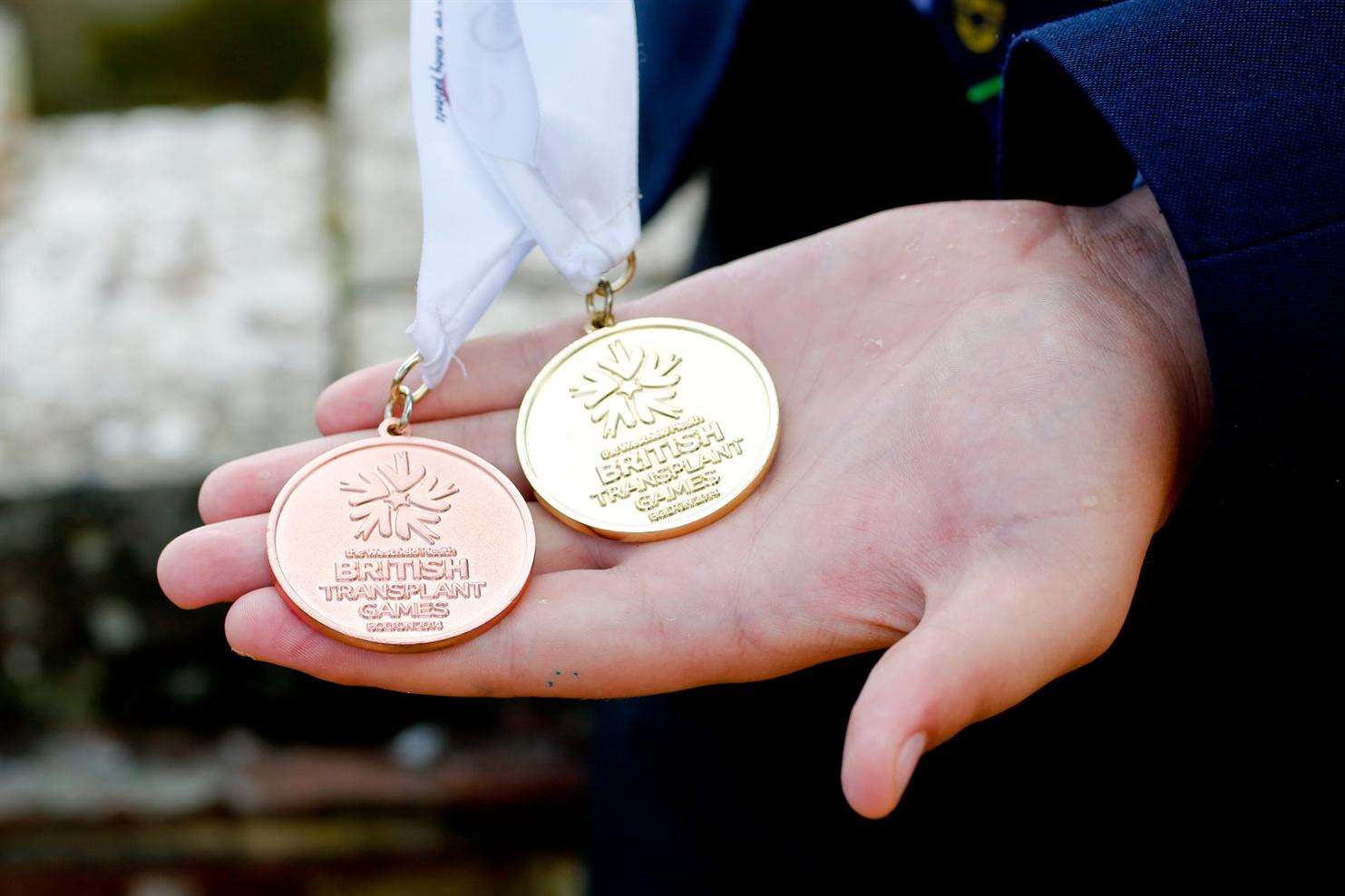 Ben's gold and bronze medals from this year's games in Bolton