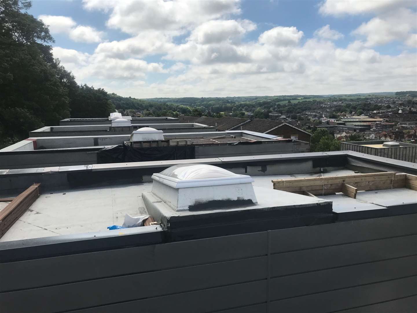 Houses at The Hamiltons have had balustrades and decking removed from terraces and roofs