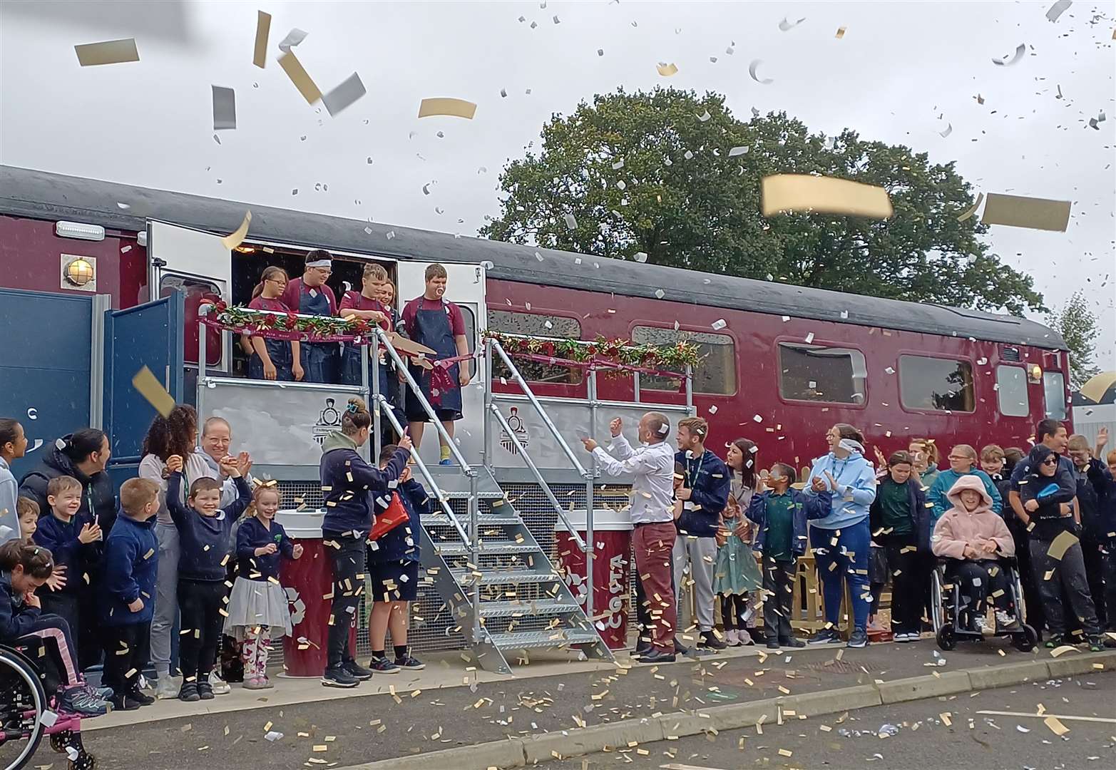 Pupils, staff and parents gathered for the ribbon-cutting ceremony of the new train cafe