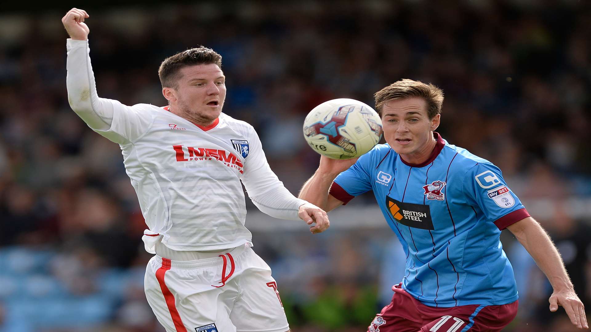 Mark Byrne challenges for the ball with Scunthorpe goalscorer Josh Morris Picture: Ady Kerry