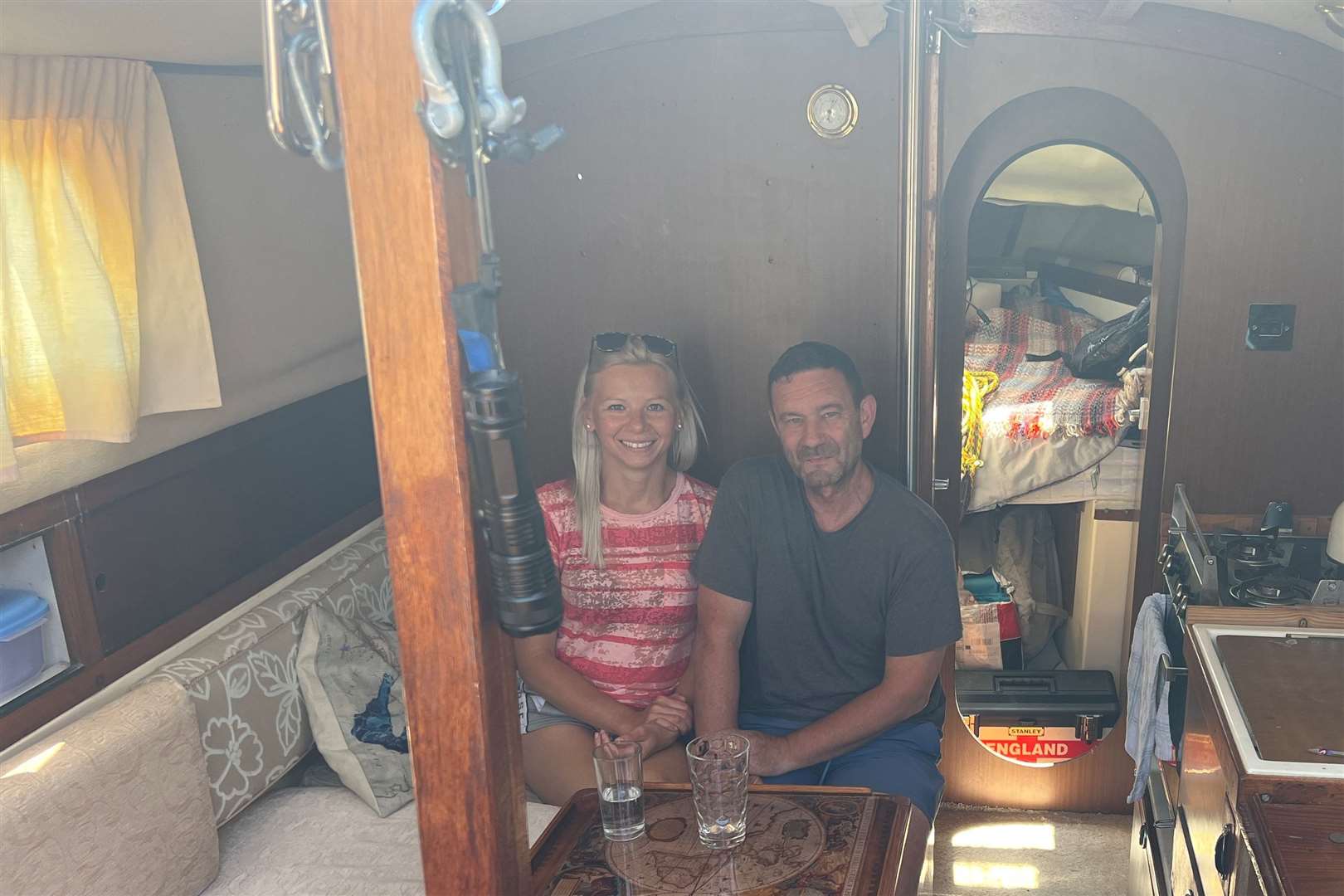 Karolina Rafalko and Lee Ward inside their boat. Picture: Megan Carr