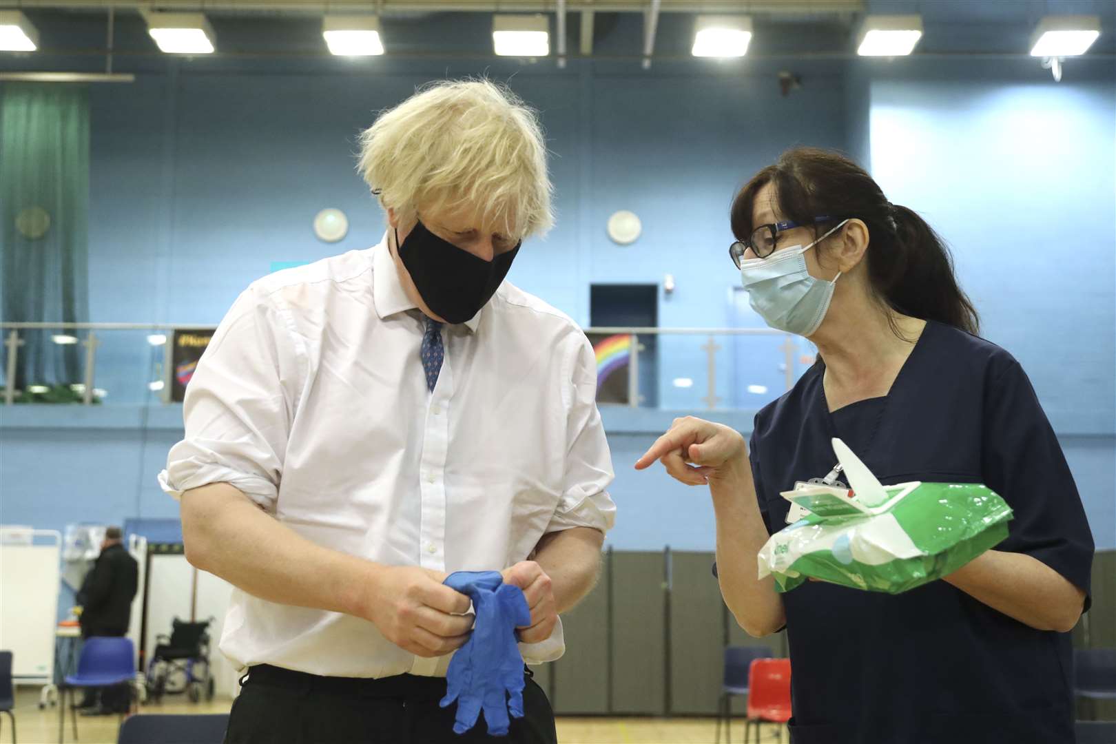 Prime minister Boris Johnson speaks with health worker Wendy Warren in Cwmbran (Geoff Caddick/PA)