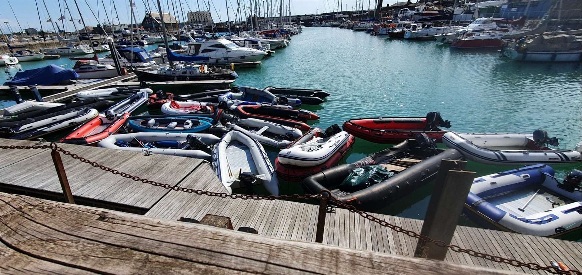 A stash of abandoned dinghies and canoes previously pictured at Dover marina. Stock picture