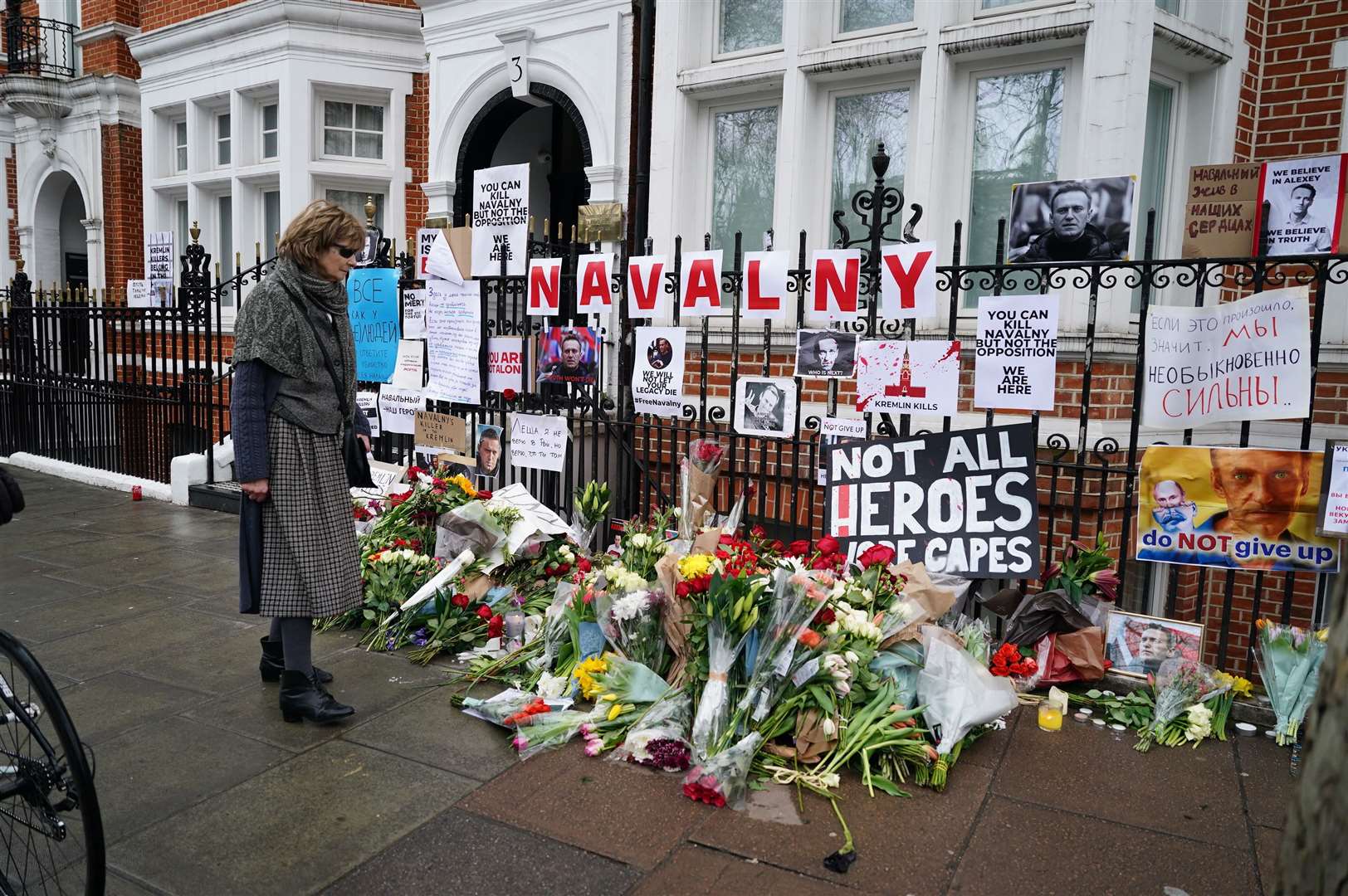 Floral tributes outside the Russian embassy in London for Alexei Navalny, who died on Friday (Jordan Pettitt/PA)