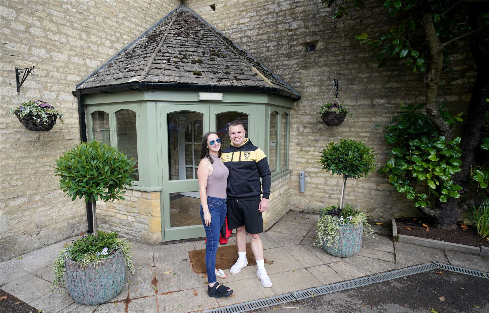 Lauren Hanly and Blake Jones from Gloucester at the front of the queue outside The Farmer’s Dog (Ben Birchall/PA)