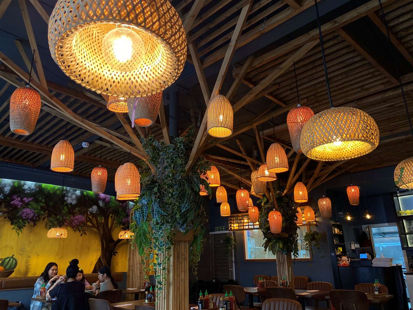 Woven lights were hung from the ceiling, which gave the place a soft ambience