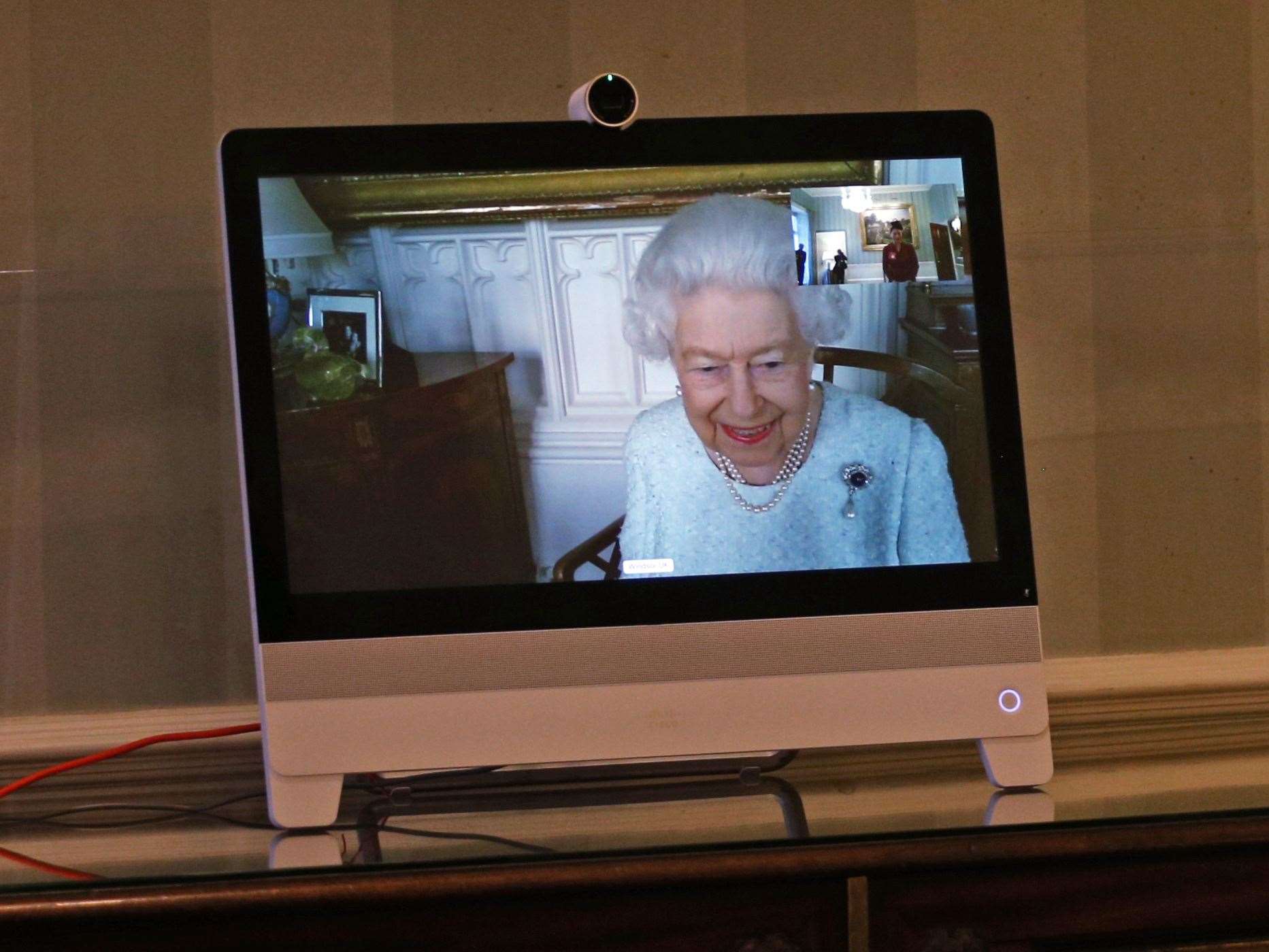 The Queen appears on screen from Windsor Castle during the virtual audiences (Yui Mok/PA)