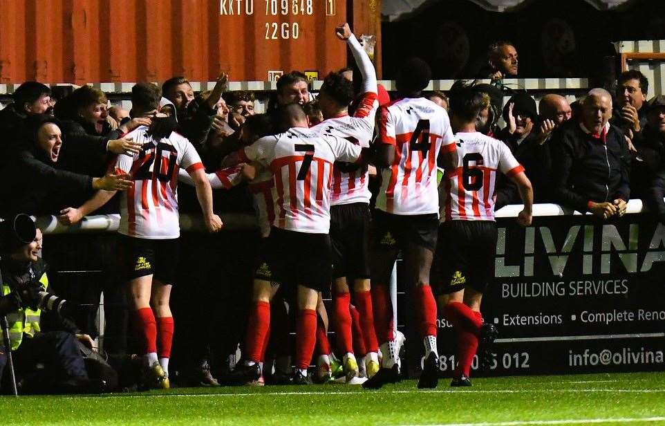 James Bessey-Saldanha celebrates with the fans as he sends the Sheppey supporters into dreamland. Picture: Marc Richards