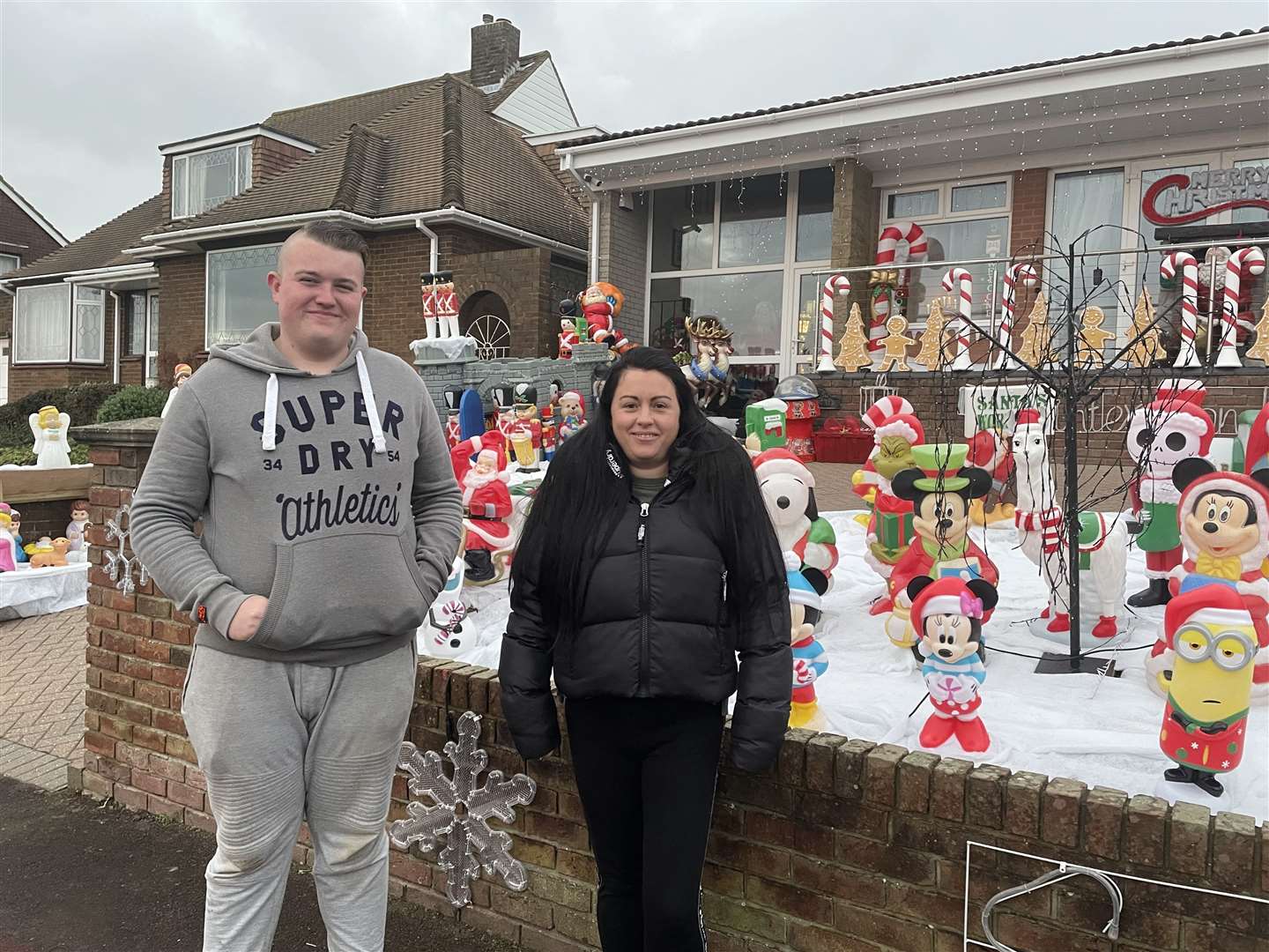 From left: Luke Palmer and Zoe Murphy with their Christmas light display in Kingsway, Gillingham