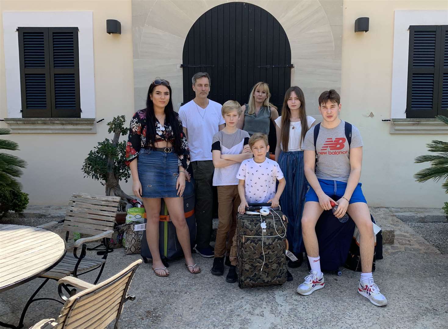 Angus Kennedy and his family outside the villa they expected to be renting