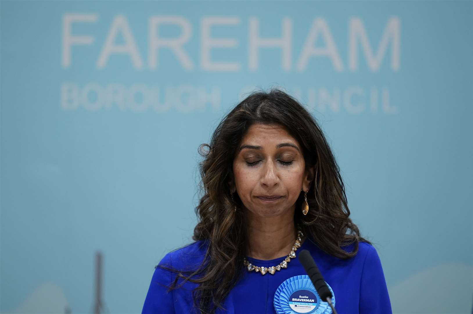 Former home secretary Suella Braverman closes her eyes as she gives a speech (Andrew Matthews/PA)