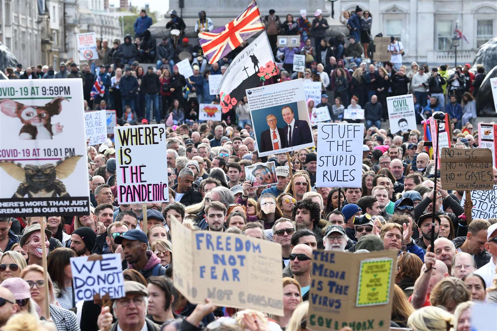 People take part in the rally to protest against coronavirus restrictions (Stefan Rousseau/PA)