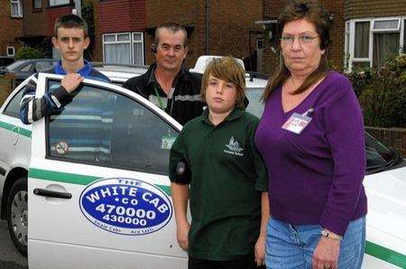 Driver Paul Smith, centre, and KCC Escort Jackie Moore with two of the boys who were in the cab at the time of the accident.