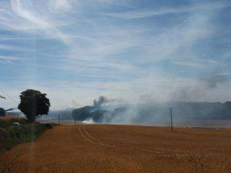 Field fire threatened to spread to A2