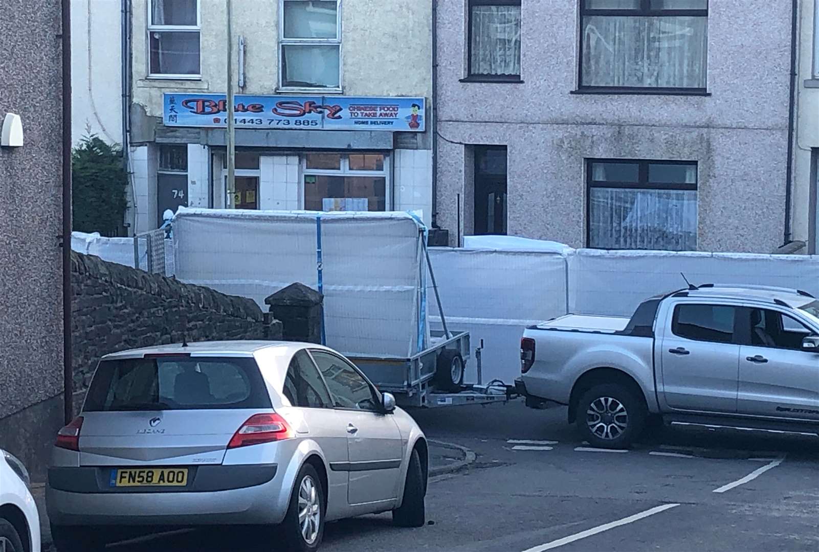 Barriers outside Blue Sky Chinese takeaway in Ynyswen where Wenjing was killed (Adam Hale/PA)