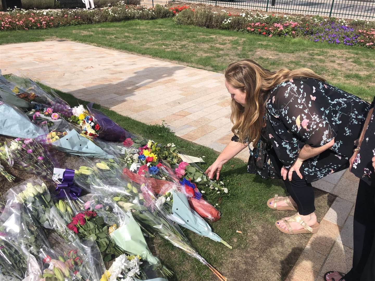 Tanya Aldam laying flowers in Dartford