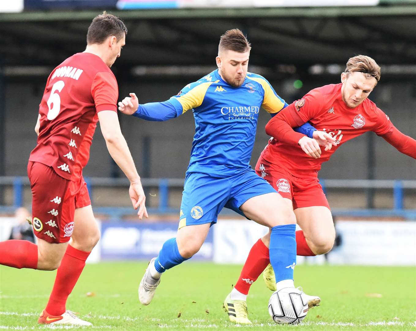 Dover defenders Danny Collinge and Jake Goodman pay close attention to home player Josh Barrett who tries to break through. Picture: Tim Smith