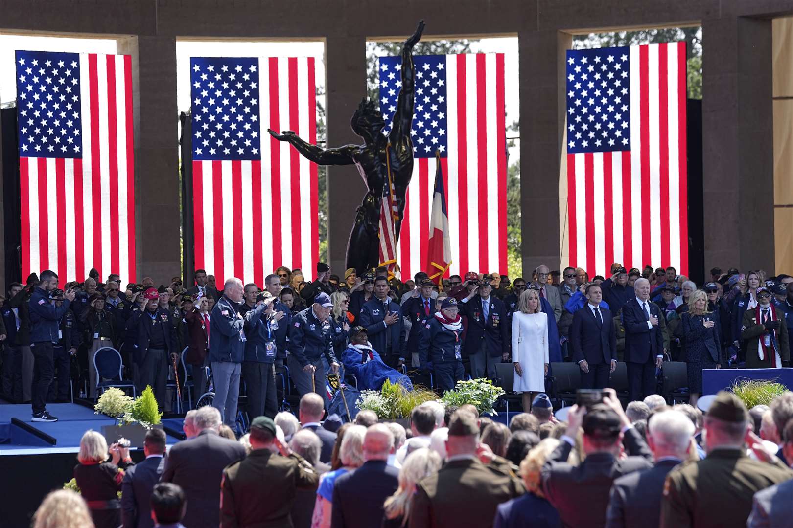 French President Emmanuel Macron, his wife Brigitte Macron and US President Joe Biden and first lady Jill Biden attend a ceremony at a US cemetery near Colleville-sur-Mer, Normandy (Laurent Cipriani/AP)