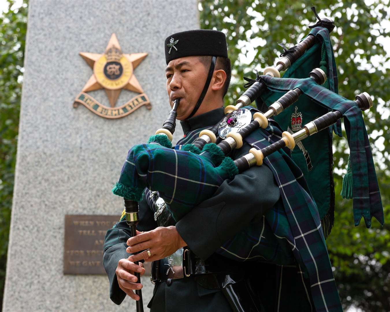 Colour Sergeant Lil Bahadur Gurung playing the pipes in front of the Burma Star Memorial (Sgt Graham Taylor RAF/MoD/PA)