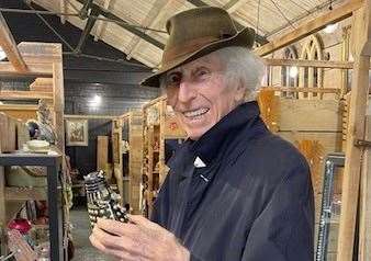 Doctor Who star Tom Baker delighted staff by posing with a Dalek at Sid’s Emporium in Tenterden. Picture: Sid's Emporium