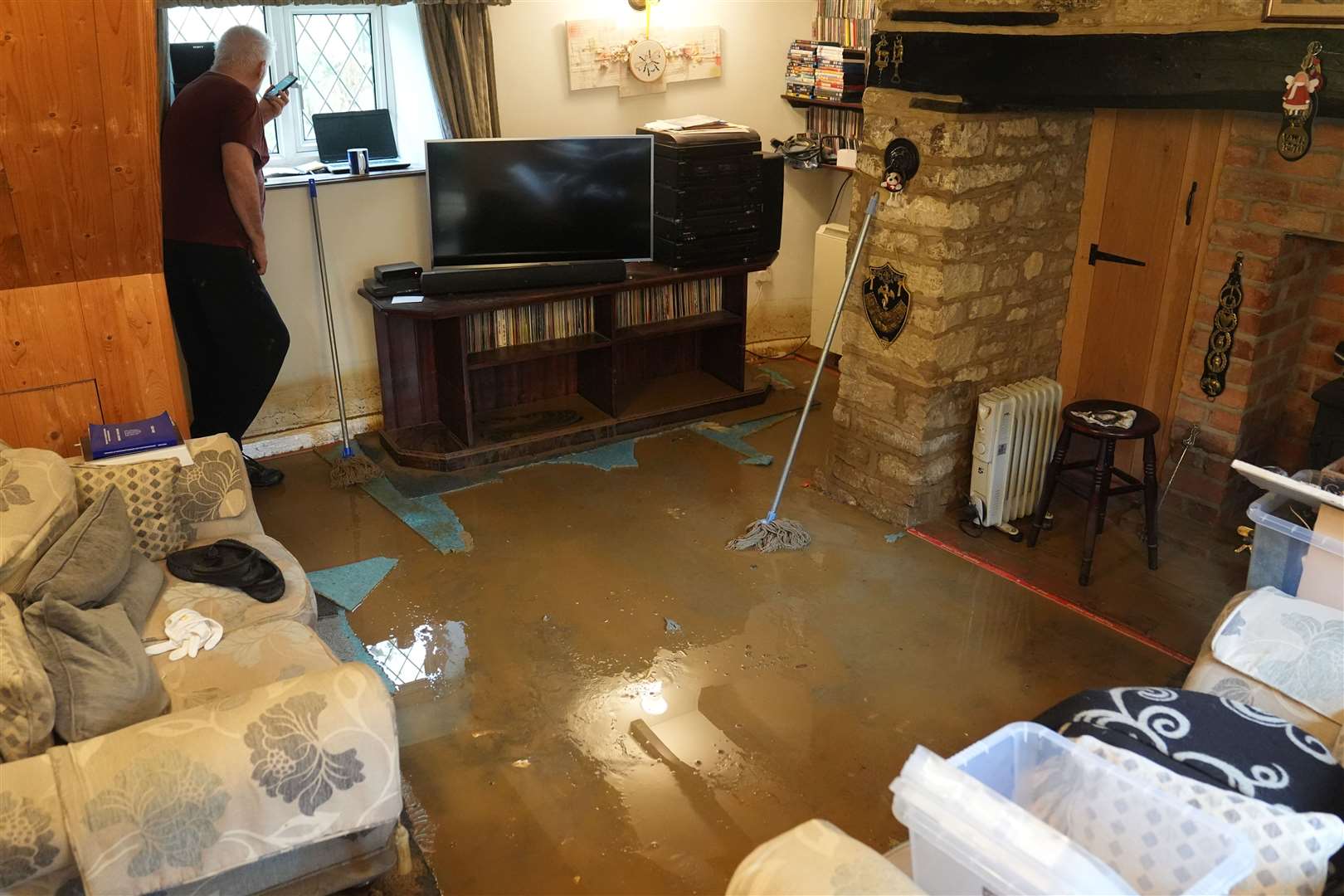 Tim Maher , from Grendon, saw his two-storey home partially submerged overnight with more than a foot of water (Joe Giddens/PA)