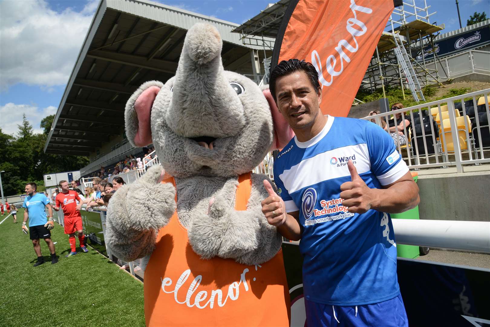 Ex Dutch International Michael Mols with the Ellenor mascot at last year's match