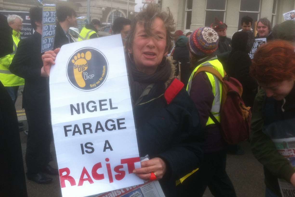 Anti-Ukip protester attacks party's leader. Ukip and Nigel Farage vehemently deny they are racist