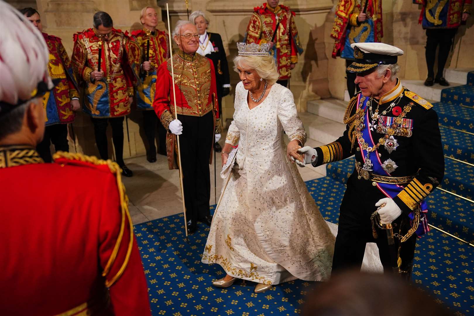 The royal couple holding hands (Victoria Jones/PA)