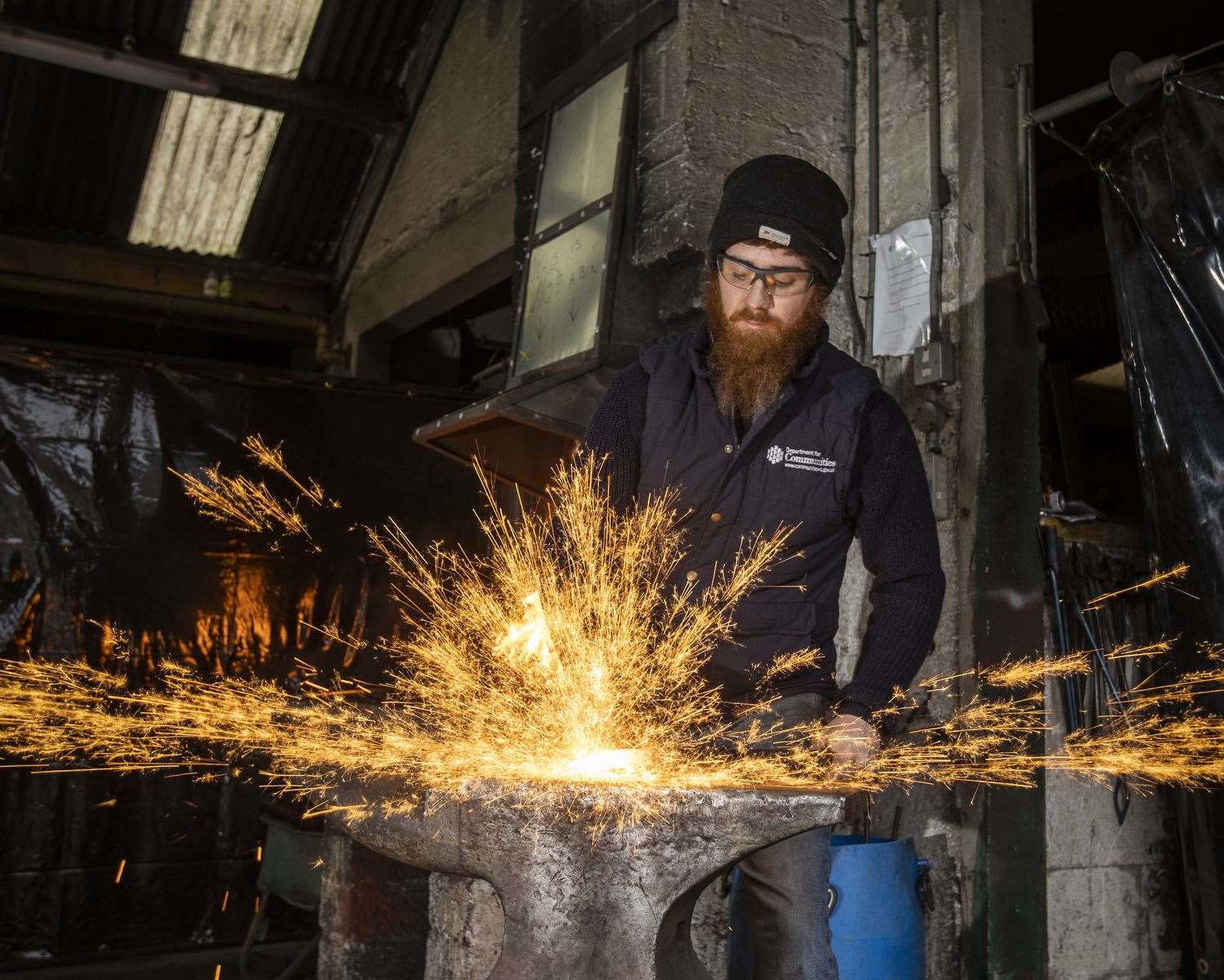 Blacksmith Owen Mort working at the forge in the heritage depot (Liam McBurney/PA)